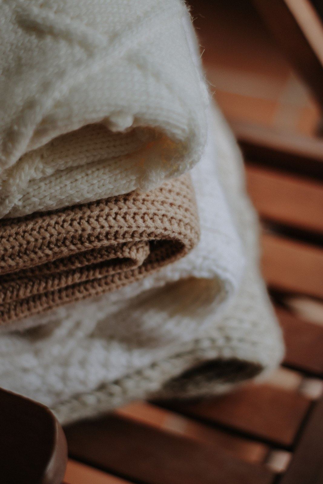 Folded wool blankets as cosy traditional seventh anniversary gift ideas