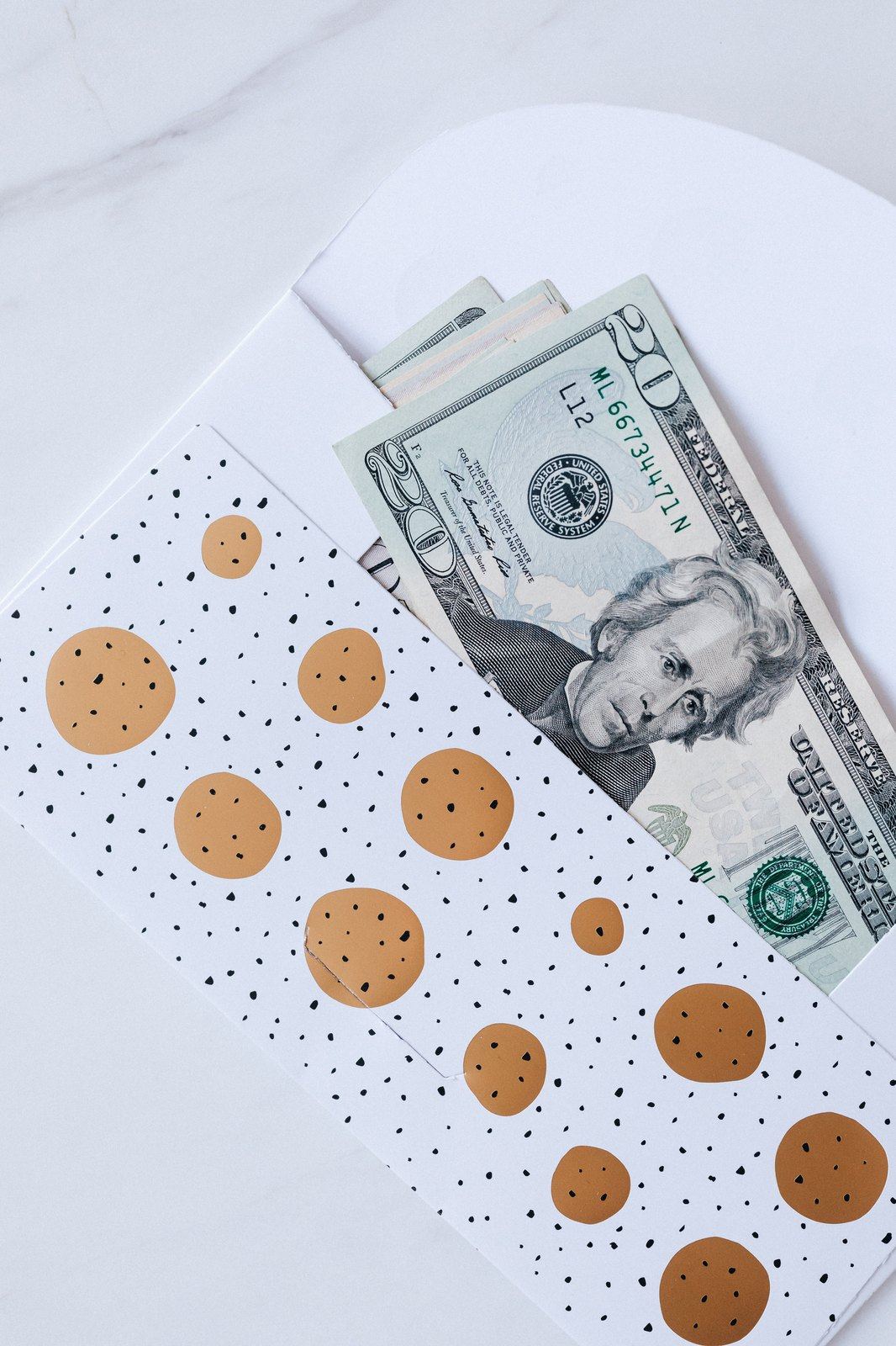 Twenty dollar bill in a decorative gift envelope.