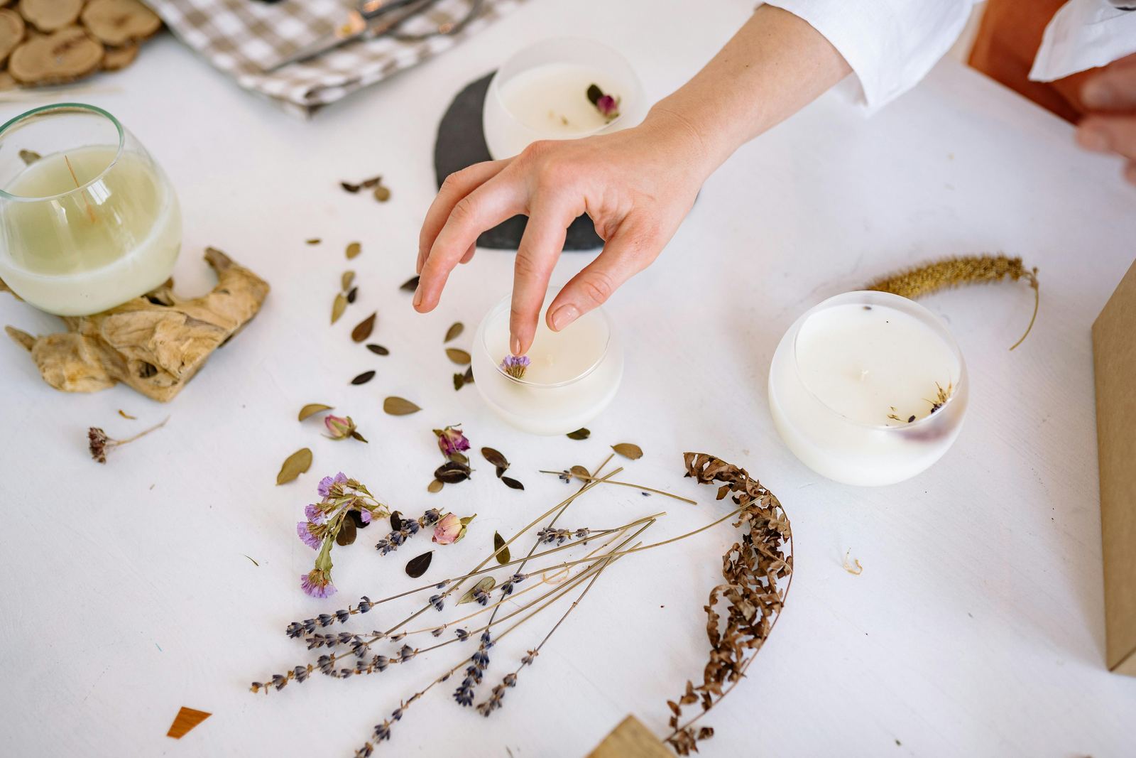 Floral decoration of candles with dried flowers