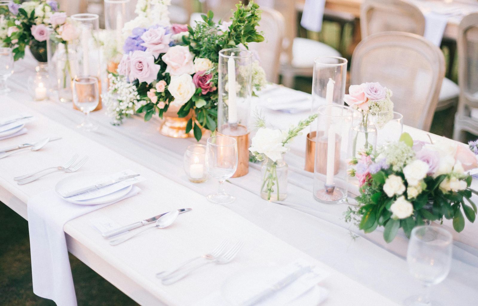 Wedding reception with pastel candles and flowers