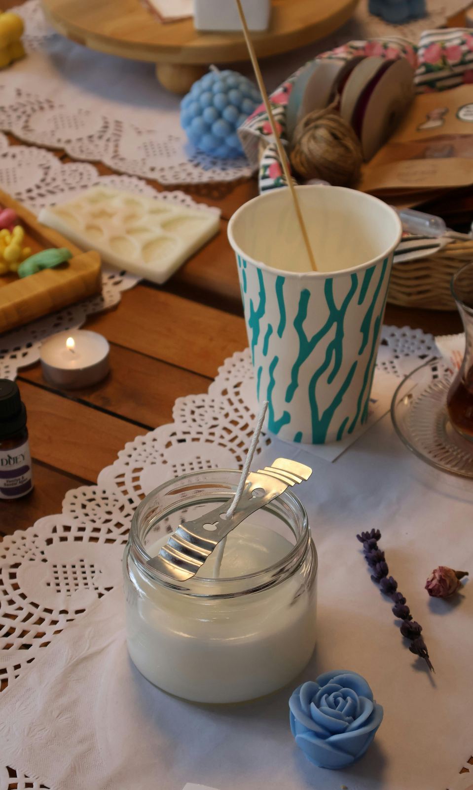 Molds and small wax shapes to decorate a wedding candle